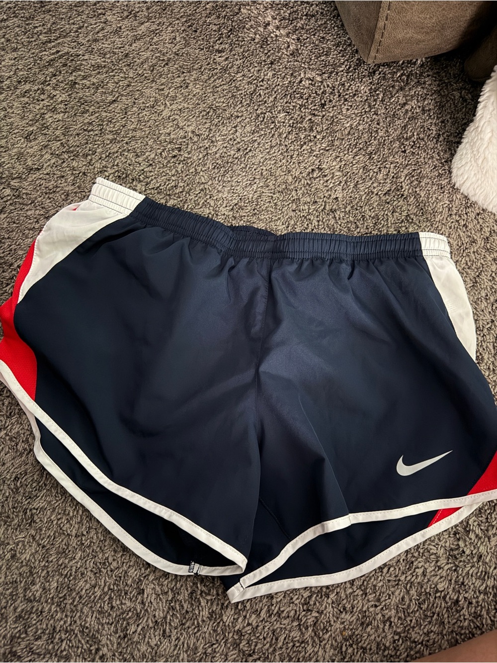 Nike Women’s Navy Blue Athletic Shorts with White Trim and Red Accents